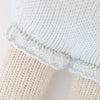 Close-up of Cuddle + Kind Beatrice The Mouse - Periwinkle, featuring textured cream and light blue knits separated by a decorative edge, showcasing the intricate stitching and soft materials used in this sustainable, fair trade handmade doll.
