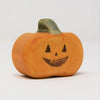 The Wooden Happy Jack-O-Lantern, a carved wooden pumpkin crafted from sustainable hardwood, features a green stem and a joyous face with triangular eyes and a jagged mouth. Perfect for Halloween displays, it is showcased against a plain white background.