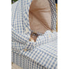 A close-up of a Doll Pram - Blue Checkered with a quilted, blue and white checkered pattern and tan interior. The carrier features small buttons and a "handmade" label.