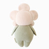 The Cuddle + Kind Baby Daisy - Blush Pink is a hand-knit plush toy crafted from natural Peruvian cotton yarn, with a round pink flower head and green body, shown from the back on a white background.