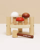 The Woodland Mushroom Hammer Game features three smiling mushroom pegs—white, red, and brown—in a circular base. Includes a Le Toy Van mallet for playful fine motor skill development.