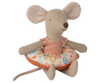 The Maileg Beach Mouse With Float, Little Sister - Flower features a soft beige mouse with large ears and a long tail, wearing a pink swimsuit and sitting inside a colorful floral-patterned float.