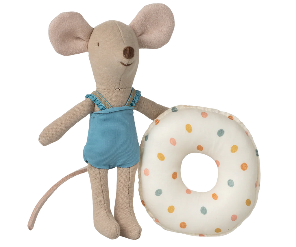 The Maileg Beach Mouse With Float, Little Sister - Multi Dot features a plush mouse in a blue swimsuit standing beside a colorful, polka-dotted donut-shaped float.