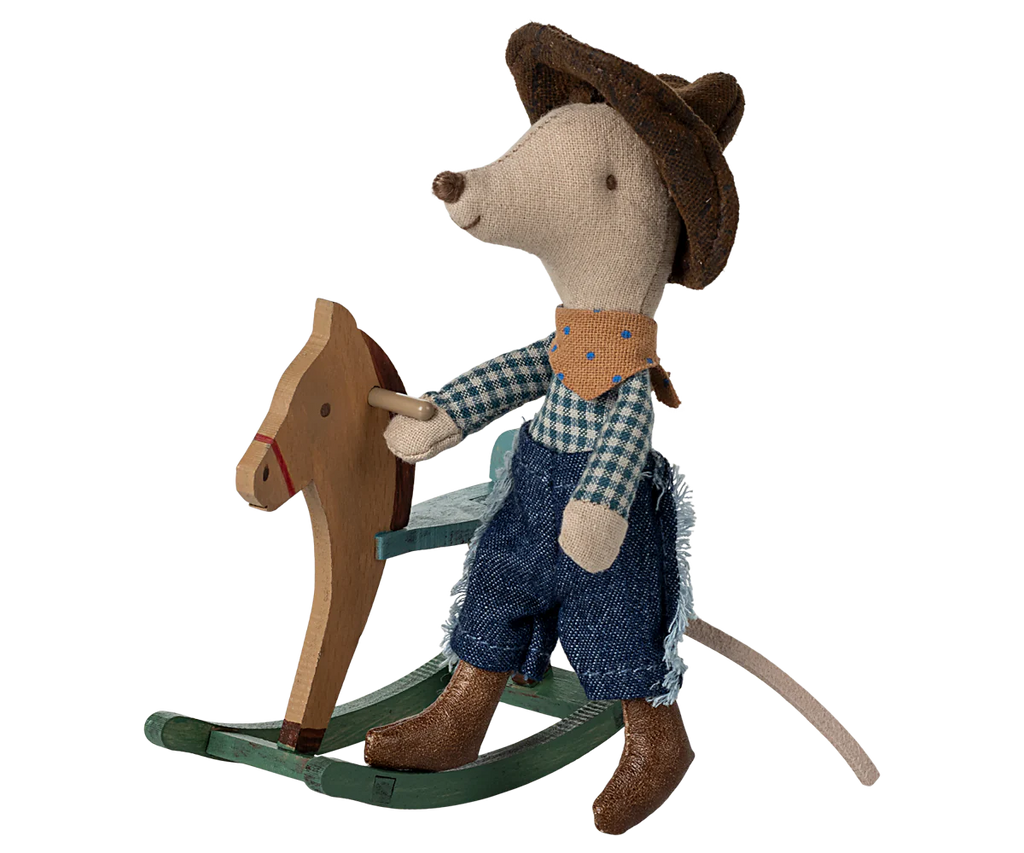The Maileg Cowboy Mouse On Rocking Horse, Little Brother—dressed in a hat, bandana, plaid shirt, jeans, and boots—is an adorable play set addition. Ships in one week.