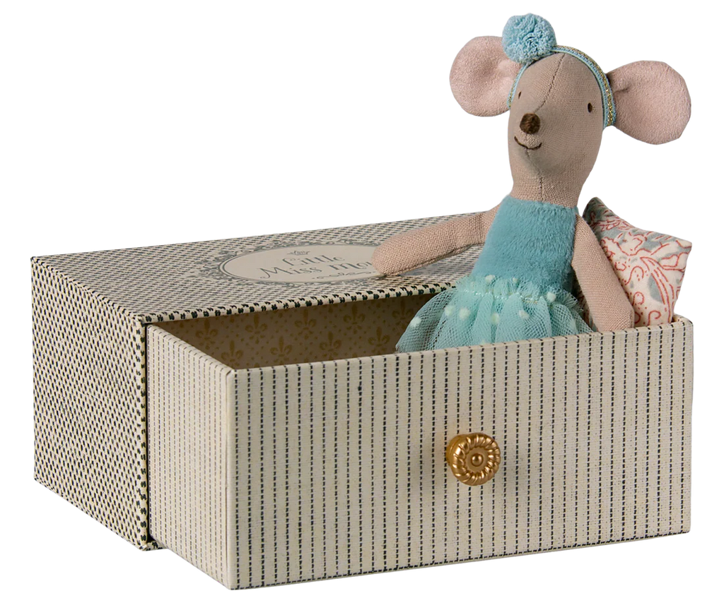 The Maileg Dance Mouse in Daybed, Little Sister - Mint, features a small sister mouse in a mint dress and headband sitting inside a patterned daybed box with a pull-out drawer, holding a tiny mint-patterned pillow.