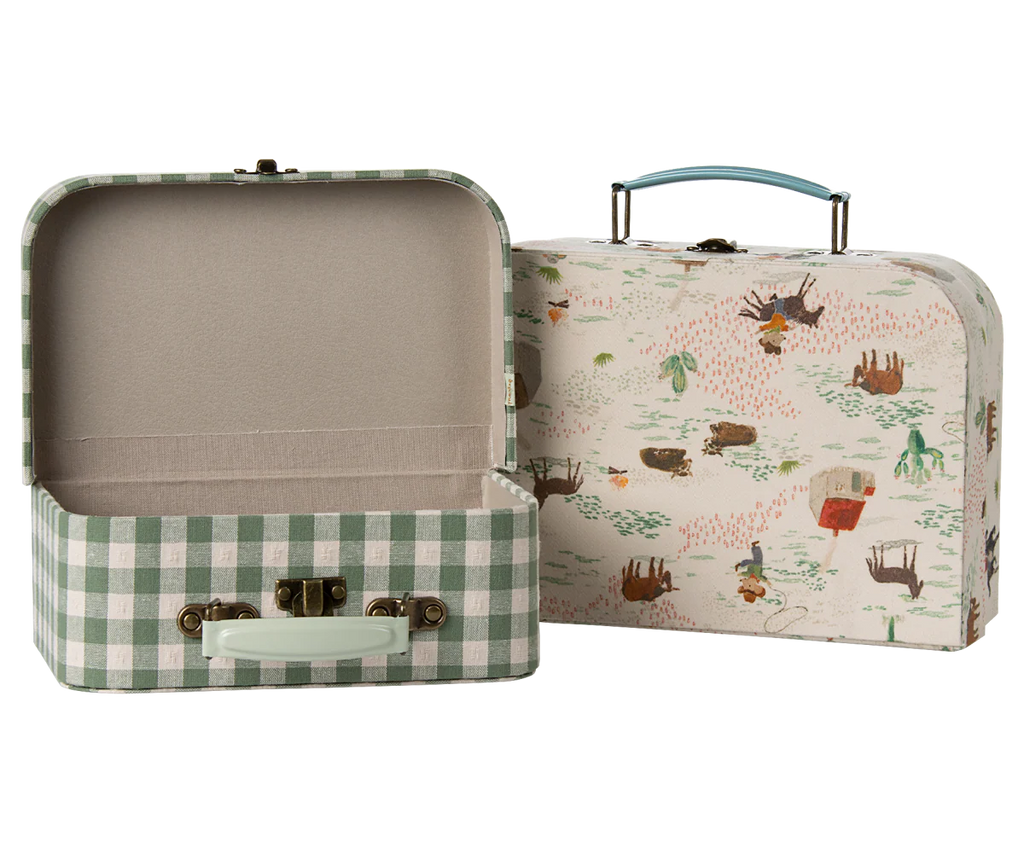 The Maileg Suitcase Set, 2-Pieces - Pony includes one open green and white gingham case and one closed with a handle featuring playful pony-themed illustrations—ideal for charming storage or play.