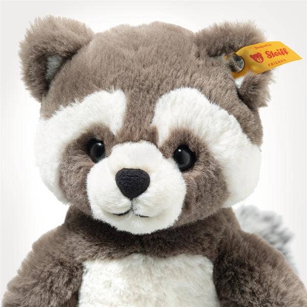 The Steiff Pedro Raccoon 9" is a plush toy featuring gray and white fur, round black eyes, and a yellow Steiff tag in its left ear, shown against a plain white background.