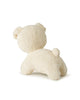 The Miffy Snuffy Stuffed Animal from Bon Ton Toys is cream-colored, shown from behind sitting on all fours with its head turned left. It features a soft, fuzzy texture and eco-friendly recycled PET filling.