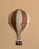 The Hot Air Balloon - Dark Brown features brown and beige stripes with a small woven basket, set against a solid light brown background—ideal for handmade children's room decoration or whimsical hot air balloon-themed decor.