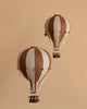 The Hot Air Balloon - Dark Brown features brown and beige stripes with a small woven basket, hanging against a solid beige background—perfect as handmade children's room decoration or charming hot air balloon-themed decor.