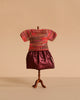 A Maileg Mum Mouse mannequin models the Extra Clothing set—featuring a multicolored knitted blouse and shiny burgundy skirt—against a plain beige background.