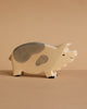The Holtztiger Boar is a high-quality, handcrafted wooden figurine featuring light beige and gray spots, a smiling face, and minimal details. Perfect for any collection, it ships in one week.