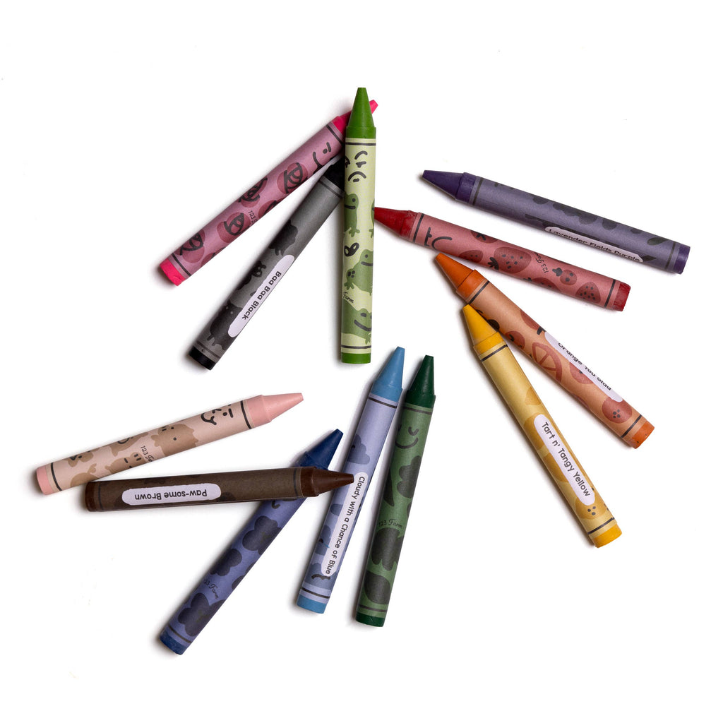 Twelve vibrant, non-toxic 12 Beeswax Crayons with playful doodles and labels are arranged in a circle on a white background.