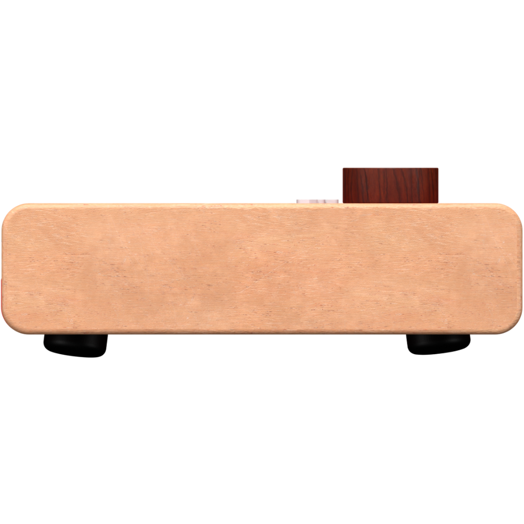 The Loog Piano is a rectangular device with a smooth, light brown surface, rounded edges, and a single dark brown knob on top—ideal as a portable digital piano with velocity-sensitive keys.