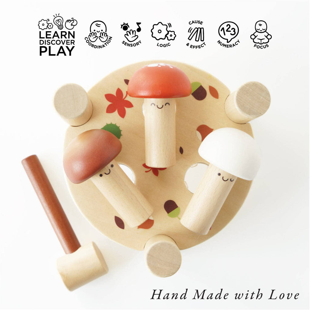 The Woodland Mushroom Hammer Game features three mushroom-shaped pegs (red, orange, white) in a round base, a small mallet, and icons for fine motor skills, logic, numeracy. Text: "Hand Made with Love.