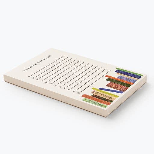 The "To Do, Or Not To Do Notepad" features horizontal lines and a stack of colorful, illustrated books along the right edge, perfect for jotting down tasks on any desk.
