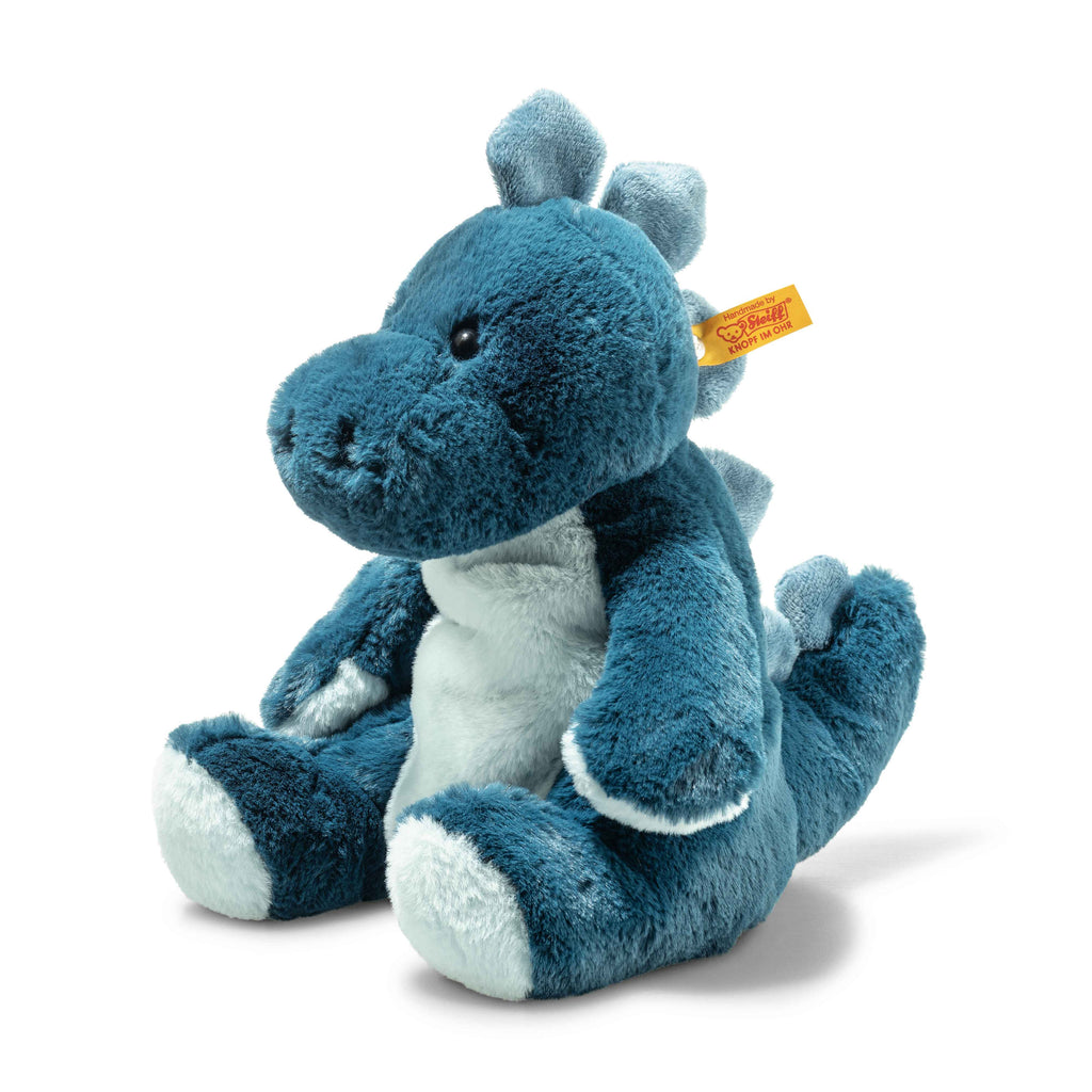 The Steiff Light at Night Spott Stegosaurus Stuffed Plush, 11 Inches, features a soft blue and white texture, light blue spikes on its head, back, and tail, a yellow ear tag, and is USB rechargeable for use as an adorable dinosaur night light.
