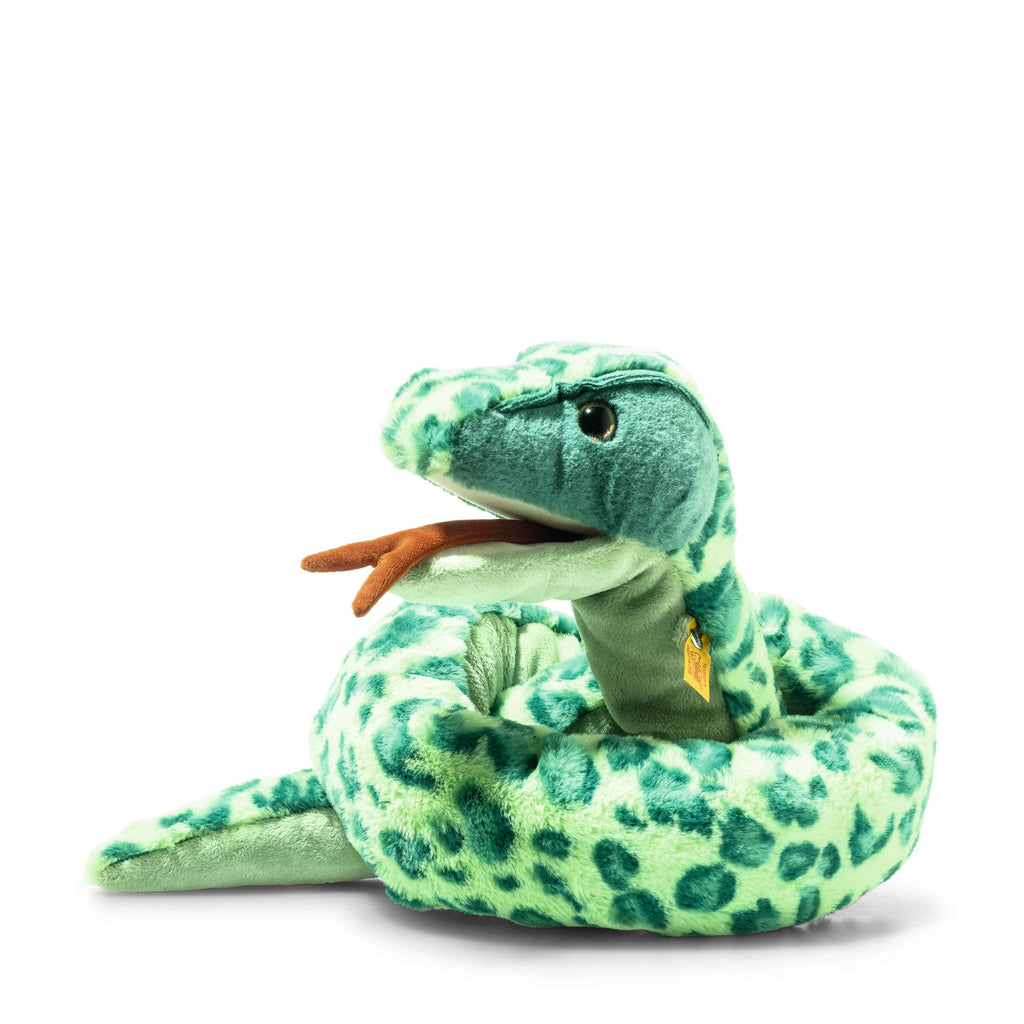 The Steiff Gin Snake Stuffed Plush Animal, 51 Inches, features a soft green body with dark green spots, stitched eyes, curled shape, brown forked tongue, and gold neck tag—an ideal cuddly playmate for kids.