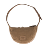 The Donsje Leather Talei Bumbag Purse - Sloth is a beige crossbody bag for kids, featuring a rounded shape, adjustable strap, and a "DONSJE AMSTERDAM" patch on the front. It is shown against a plain white background.