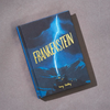 The "Frankenstein | Wordsworth Collector's Edition | Hardcover" rests on a gray surface. Its cover features a blue-tinged scene of lightning striking a house, with mountains hauntingly illuminated in the background.