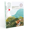 The Paint By Number Kit - Picnic in Étretat by Ananya Bhandari features a coastal landscape with cliffs, flowers, and a picnic scene. This beautifully packaged kit is made in France.