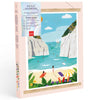 The Diamond Painting Kit - Stiniva Beach by Maja Tomljanovic features a vibrant illustration of people enjoying a sandy Mediterranean cove with white cliffs, turquoise water, colorful towels, umbrellas, and lush plants.