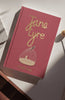 The "Jane Eyre | Brontë | Collector's Edition | Hardcover" with a red cover, gold lettering, and a birdcage illustration sits on a sunlit white surface.