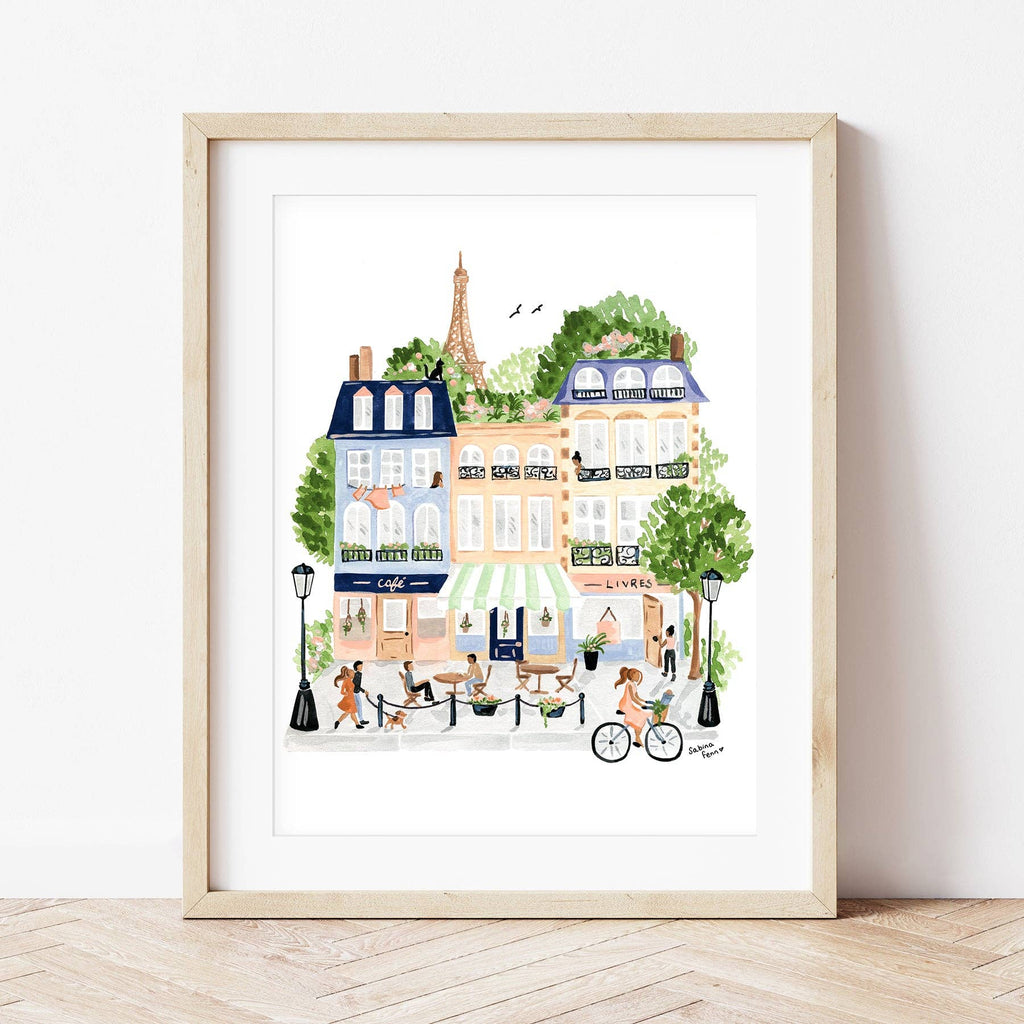 Capture the charm of Paris with the Paint By Number Kit - Paris: a framed illustration featuring cafes, strolling people, cyclists, tree-lined streets, and the Eiffel Tower—ideal inspiration for artists and a tribute to Parisian creativity.