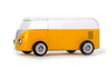The VW Beach Bus Sunset is a yellow toy van with a white top and black wheels, styled after a classic Volkswagen Type 2. It has minimal detailing, a magnetic camper top, and is shown in side view on a white background.