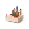 The London Music Box features miniature Big Ben, Tower Bridge, a red double-decker bus, and postbox on a square light wood base. This hand-cranked music box makes a charming decorative piece for any room.