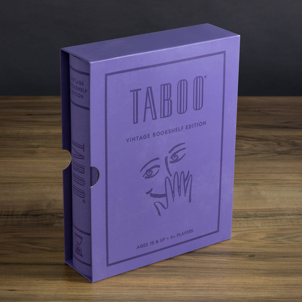 A purple box of "Board Game: Taboo Vintage Bookshelf Edition" stands upright on a wooden surface, featuring a minimalist illustration of a face with a hand partially covering its mouth.