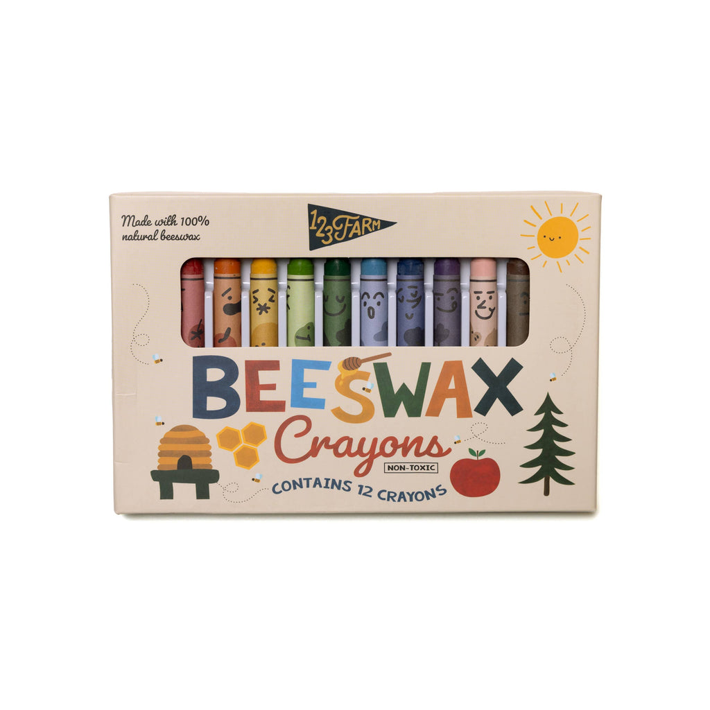 A box of 12 Beeswax Crayons – Non-Toxic, with smiling faces and eco-friendly packaging featuring a sun, beehive, apple, and leaves. The box reads "BEESWAX Crayons" and "Made with 100% natural beeswax.