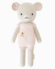 Cuddle + Kind Beatrice The Mouse - Blush is a handmade cotton yarn doll with light beige fur, dressed in a pale pink romper with pockets and floral details, shown standing upright against a white background.
