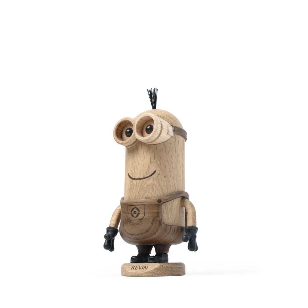 Boyhood Minions Kevin, Small is a wooden figurine crafted from European FSC White Oak, featuring goggles, black gloves, and a tuft of hair on a base labeled "Kevin"—an ideal collectible for Minions fans.