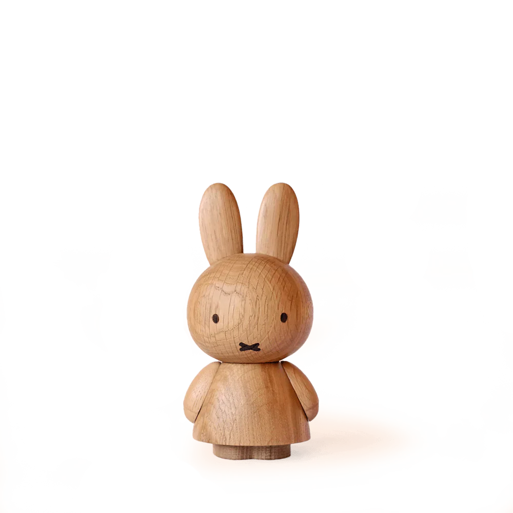 The Boyhood Miffy x Miffy, Small is a solid oak wooden bunny figurine with long ears, simple black eyes, and an X-shaped mouth, standing upright against a plain white background.