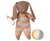 PRE-ORDER: Bunny Set, Micro - Brown - Dusty Rose (ships early November) includes a stuffed brown bunny in a striped knit romper, holding a baby bottle and sitting next to a soft fabric ball—a delightful gift for little ones.