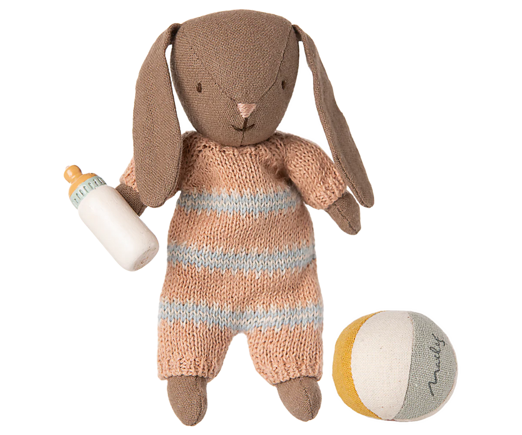 PRE-ORDER: Bunny Set, Micro - Brown - Dusty Rose (ships early November) includes a stuffed brown bunny in a striped knit romper, holding a baby bottle and sitting next to a soft fabric ball—a delightful gift for little ones.