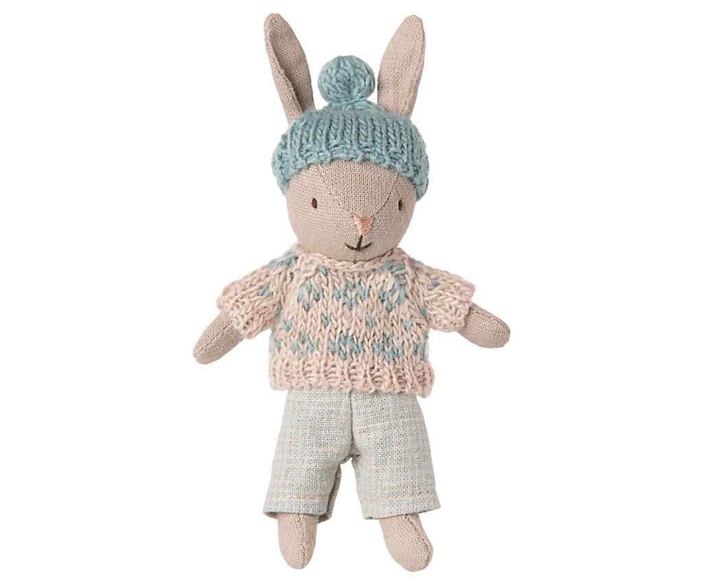 PRE-ORDER: Winter Rabbit, Micro - Sand - Mint is a soft stuffed bunny with embroidered features, floppy ears, a knitted blue pom-pom hat, cream and blue sweater, and light blue pants. Perfect for miniature dollhouses. Ships Early November.