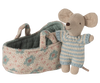 The PRE-ORDER: Baby Mouse in Carry Cot - Blue (Estimated Ship Date: Late October) features a tiny mouse in a blue and white knitted outfit standing by a floral quilted carry cot with handles and a green interior.
