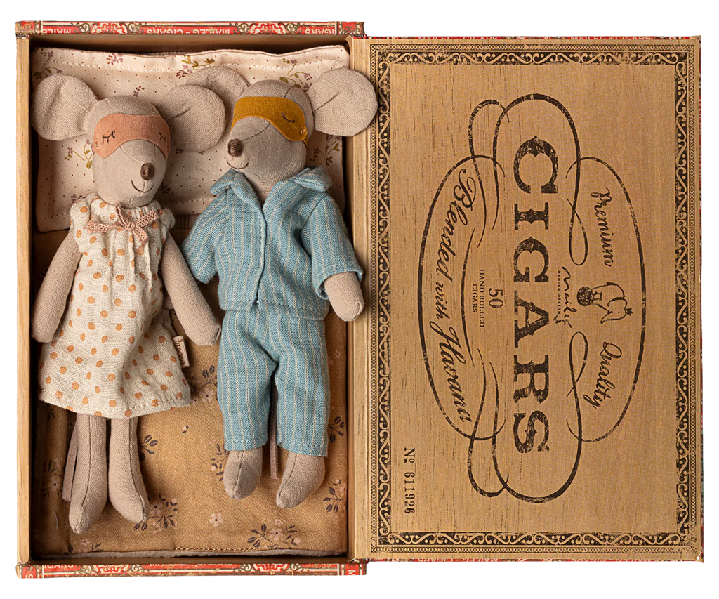 PRE-ORDER: Mum & Dad Mice in Cigarbox—dressed in polka dot nightgown and blue striped pajamas with matching eye masks—lie in a cozy box bed. Estimated ship date: Early October.