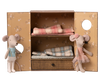 Two Ballet Mice, Little Sister in a pink dress and headband and Brother in overalls, stand by an open wardrobe with shelves and a drawer in their cozy dance studio. PRE-ORDER: Shipping late October.
