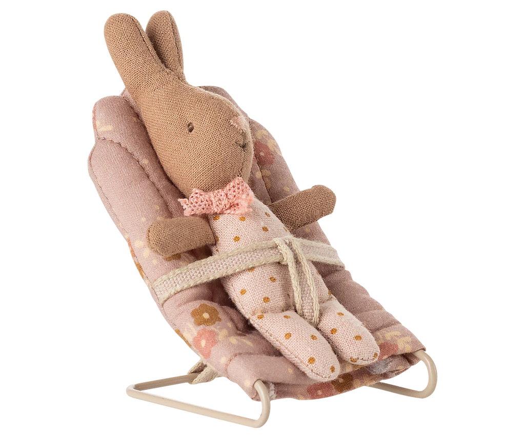 The PRE-ORDER: Babysitter, My - Rose (ships late September) features a small bunny doll with a pink bow tie strapped into a pink floral baby bouncer chair, ready to play the perfect babysitter.