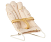 A miniature babysitter accessory, the PRE-ORDER: Babysitter, Micro - Off White features a small padded chair with white metal frame and yellow strap—perfect for micro-sized rabbits. Estimated ship date: late September.