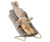 A stuffed bunny toy in a yellow checkered outfit sits secured in the PRE-ORDER: Babysitter, My - Blue baby bouncer (ships late September), featuring a lovely floral pattern.