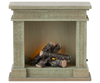 Inspired by the PRE-ORDER: Fireplace, Miniature - Dusty Green (ships early October), this artificial fireplace features decorative logs and a soft amber light—perfect for adding charm to your miniature home display.