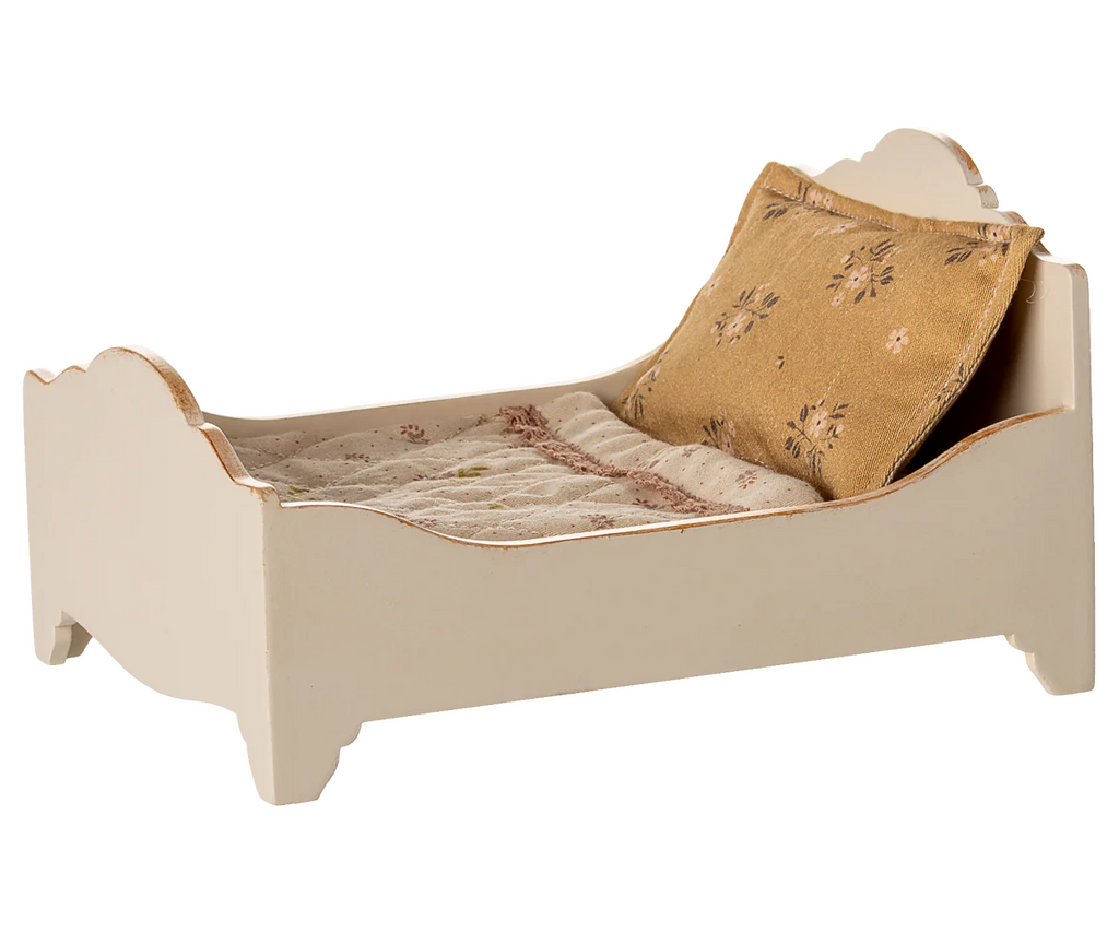 PRE-ORDER: Bed, Mouse - Off White (ships early October). A small white wooden bed with a tan floral pillow and patterned blanket—ideal for mice to sleep cozily.