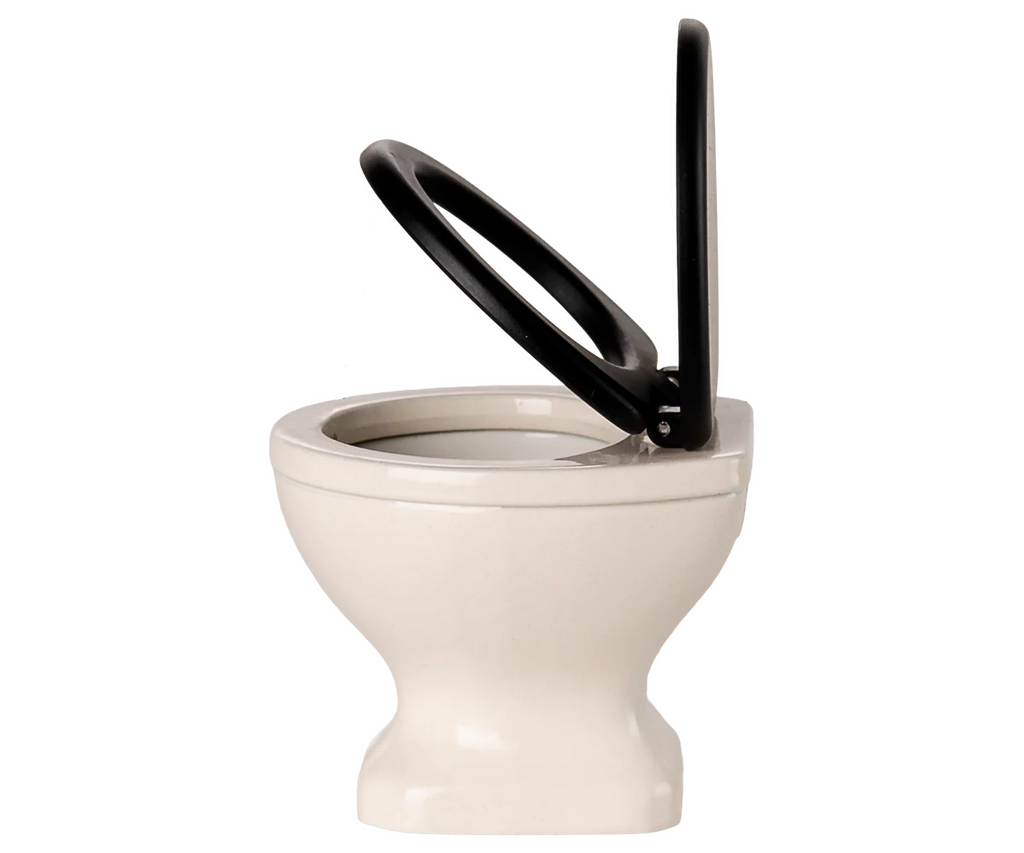 The PRE-ORDER: Toilet, Mouse Size - Off White (ships early November) features an off-white ceramic design with a black seat and lid, both raised—ideal for any SuitCasa mouse house or miniature bathroom décor.