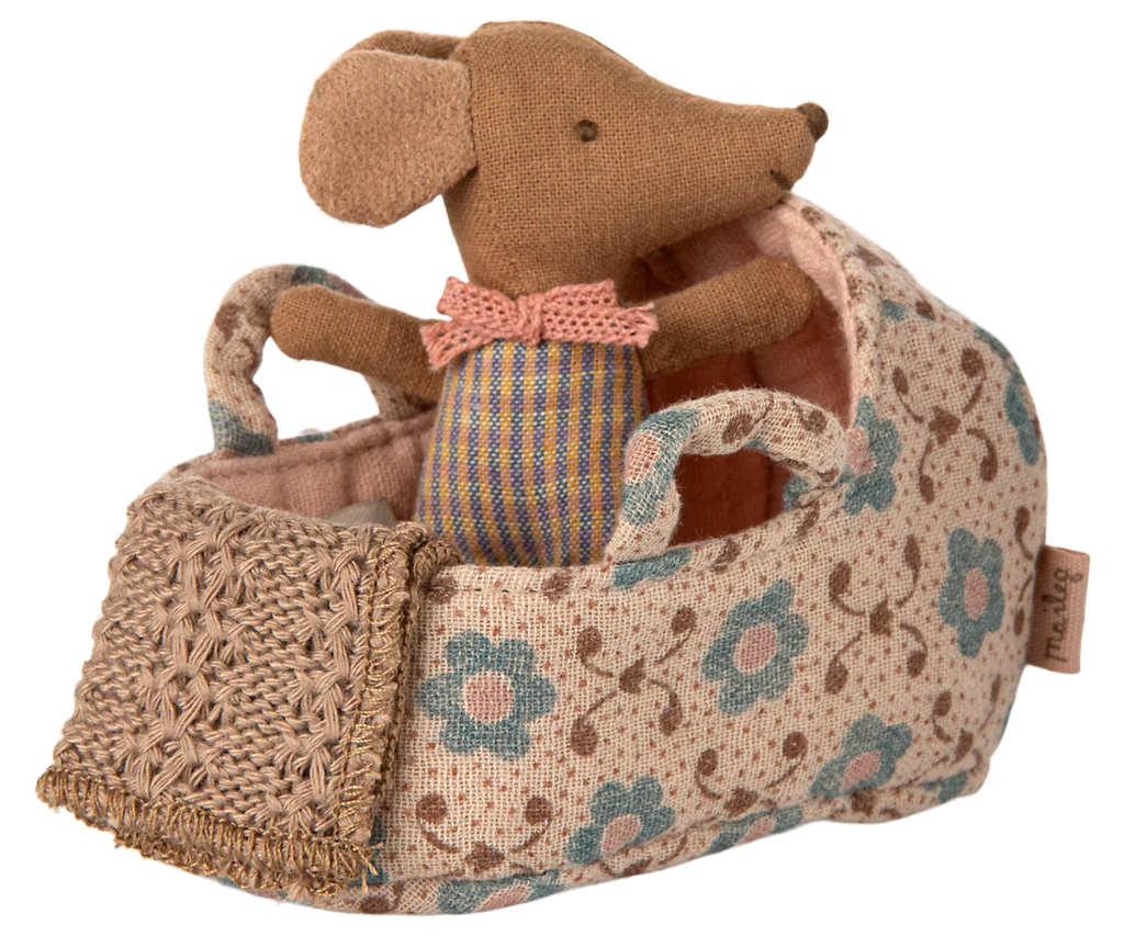The PRE-ORDER: Carry Cot, Baby Mouse Size - Rose (ships late November) includes a baby mouse in striped overalls and pink bow tie, resting in a floral carry cot with woven pillow—ideal for cozy, safe sleep.