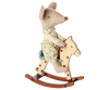 A gray mouse in polka-dot pajamas rides the PRE-ORDER: Rocking Horse, Mouse - Spotted, featuring a cream body with brown spots, green bridle, and metal handles. Approximate ship date: Early September.