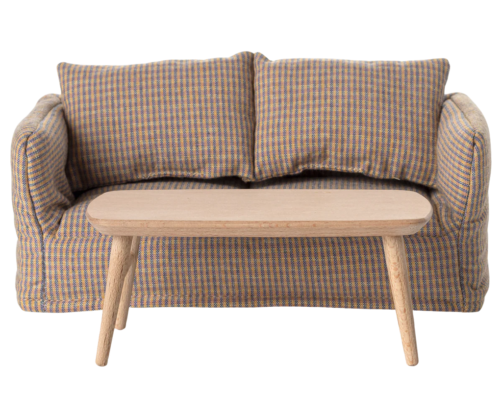 A small checkered sofa with two cushions and the PRE-ORDER: Coffee Table, Mouse - Nature (ships early October) in front, set against a plain backdrop, creates the perfect Mouse hole Farmhouse vibe.